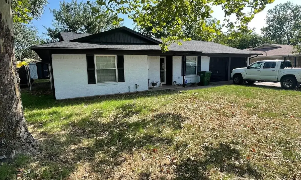 Professional roofing crew working on a residential roof in Westbrook